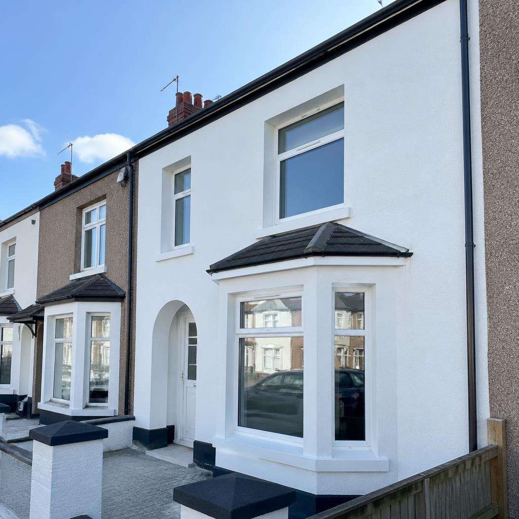 White silicone render on a UK terraced house