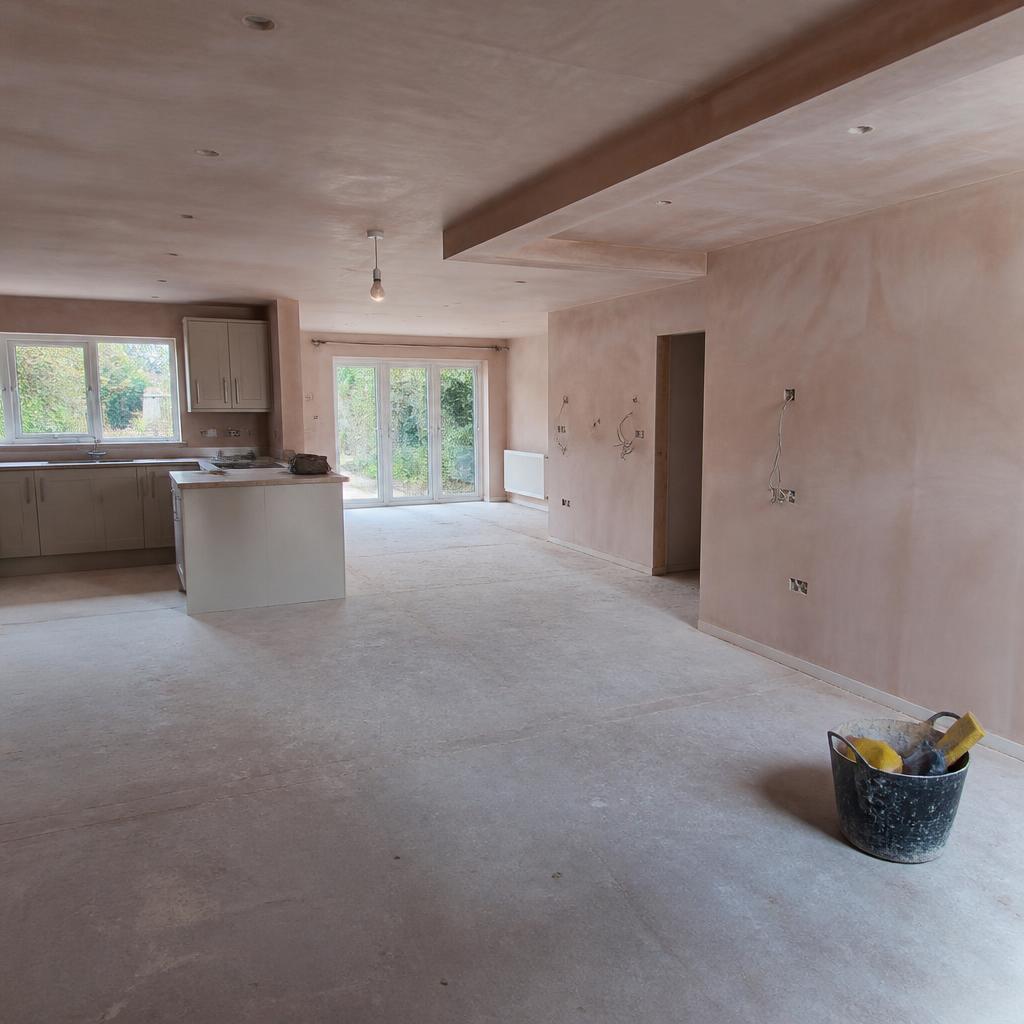 Open-plan kitchen-diner freshly skimmed throughout