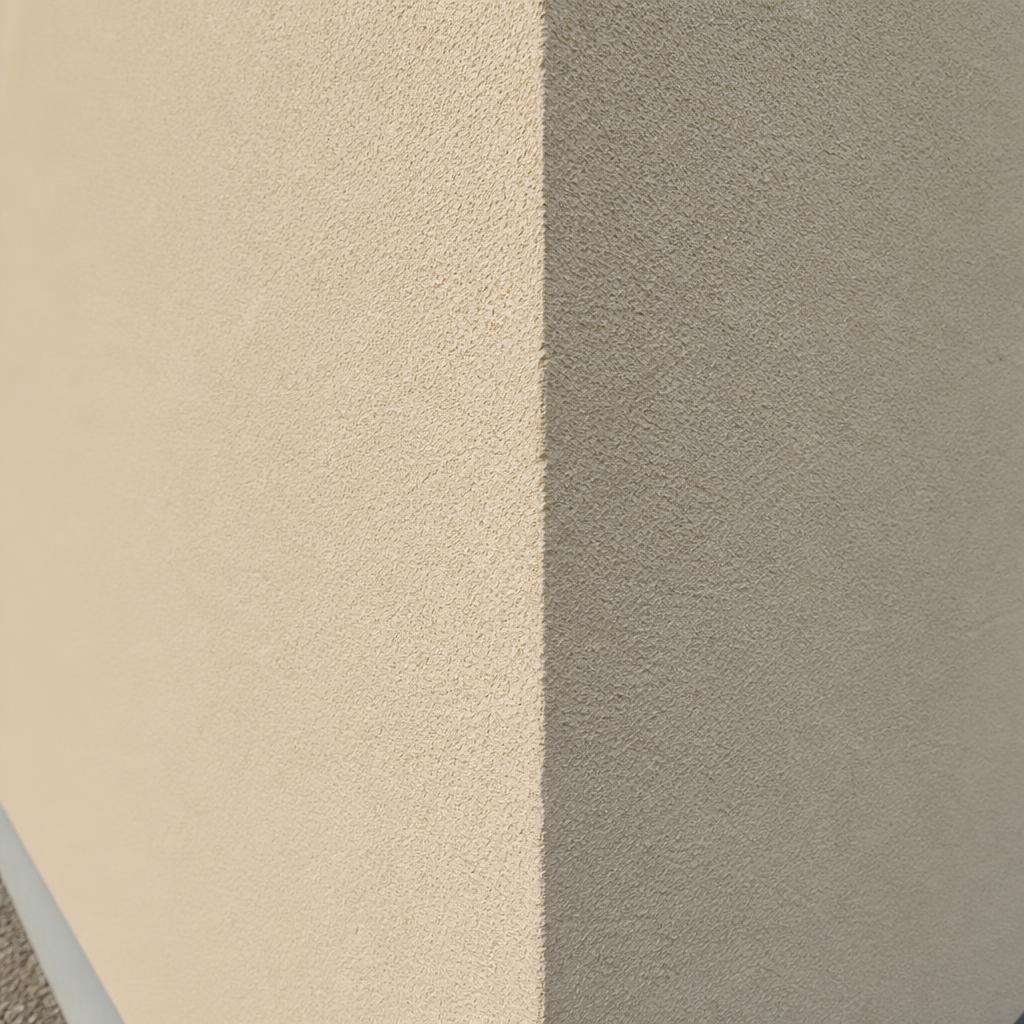 Close-up of pale cream silicone render texture