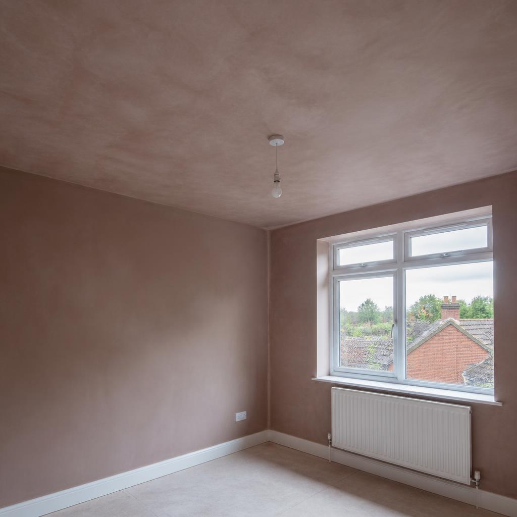 Newly plastered bedroom ceiling and walls ready to dry