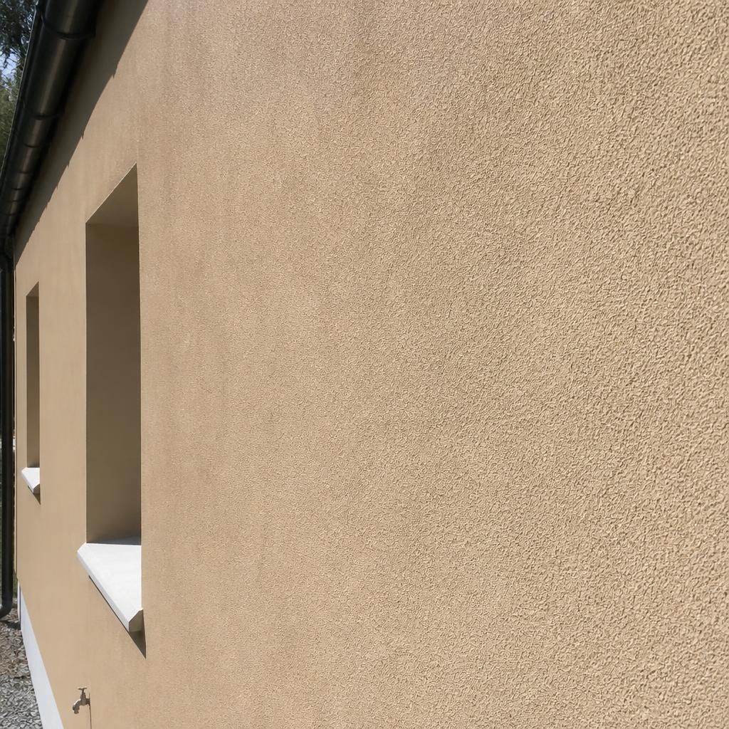 Close-up of textured silicone render on an exterior wall